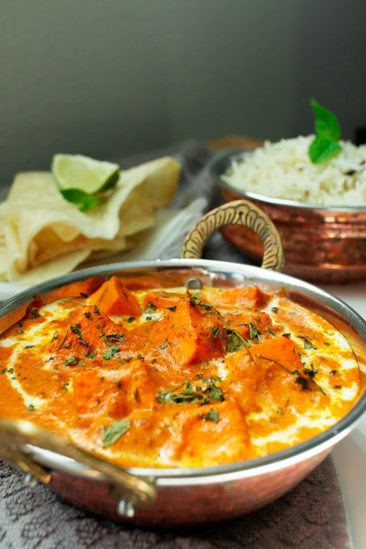 Butter chicken in a copper handi