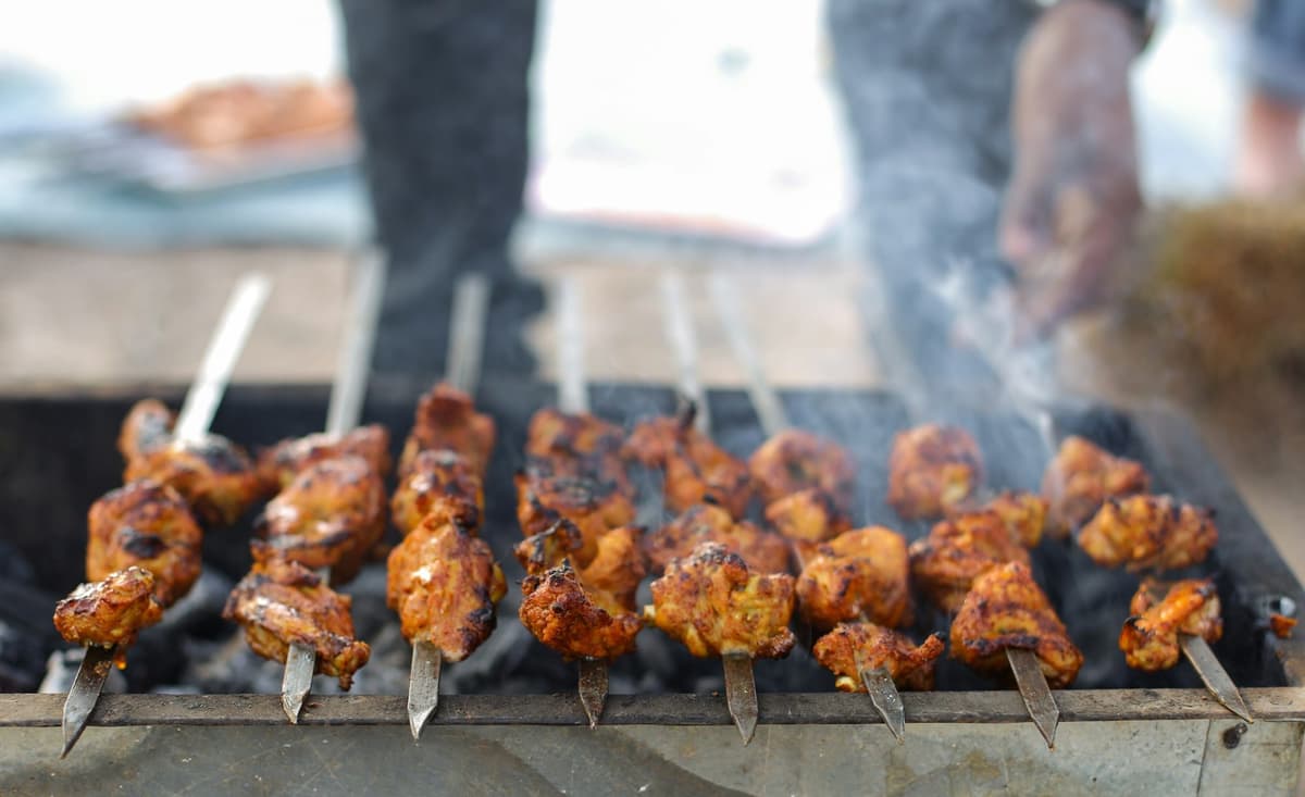 Chicken tikka boti over coals